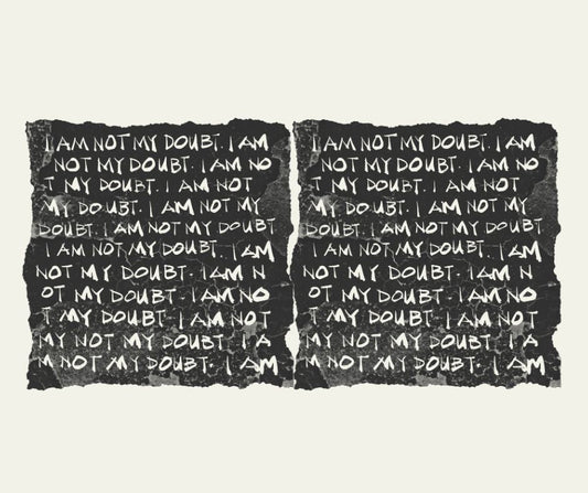 Hand-drawn artwork by Det Agustin featuring repeated white lettering on torn black paper: “I Am Not My Doubt.” A bold affirmation turned into wearable art.